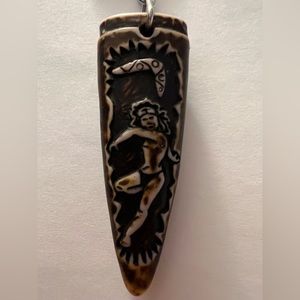 Keychain from Australia depicting a tribal with a boomerang